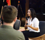 Renee Francis presenting on stage