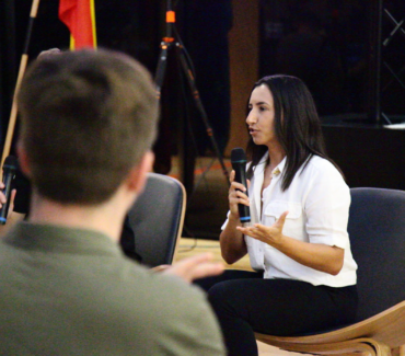 Renee Francis presenting on stage